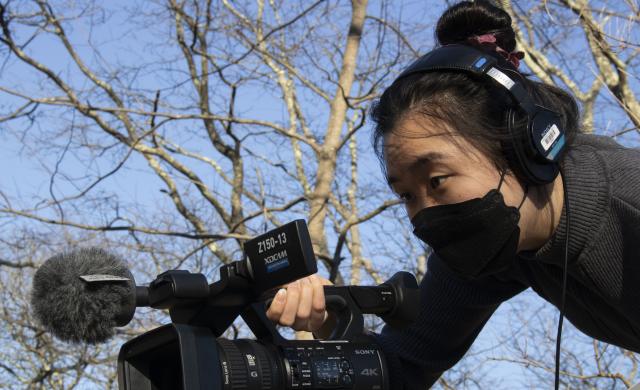 Image of author holding a camera