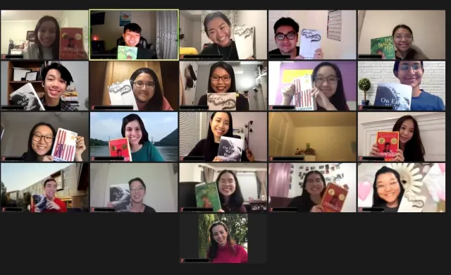 Group of students on Zoom holding up books