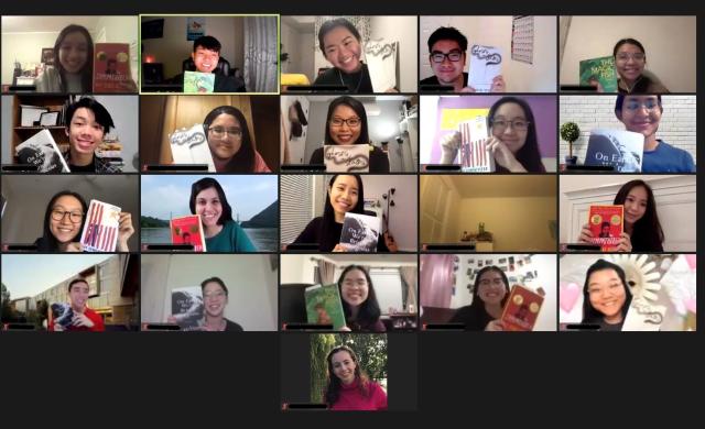 Group of students on Zoom holding up books
