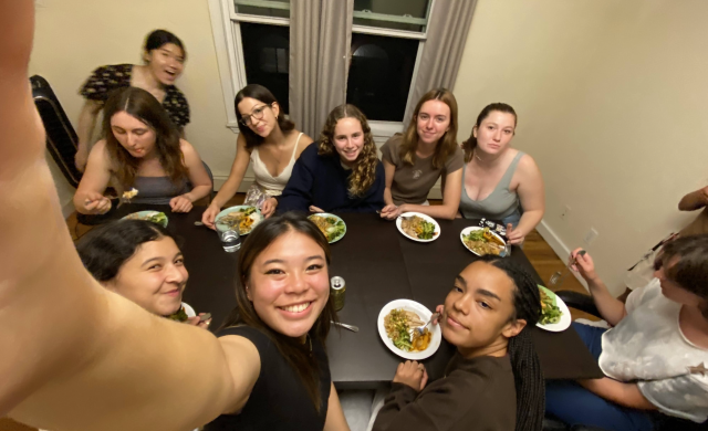 Erika and friends gathered around a table having a meal