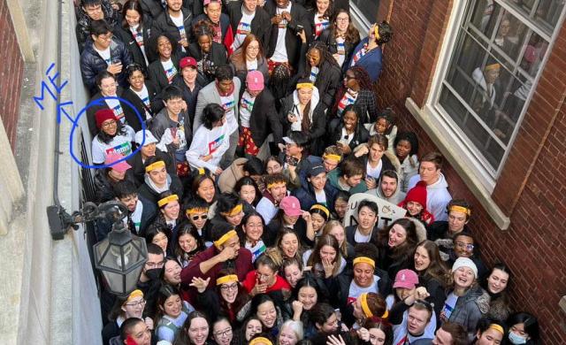 Students crowding in front of Adams house