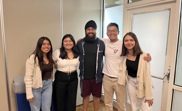 A group of students hugging each other.