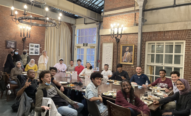 A large group of Muslim students having dinner together