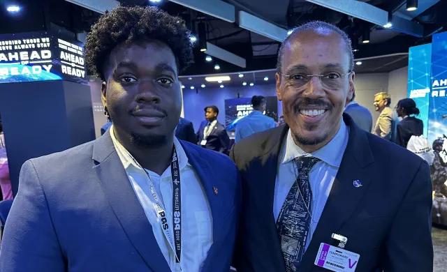Denzel Ekes and Astronaut Benjamin Alvin Drew pictured together smiling at the camera.