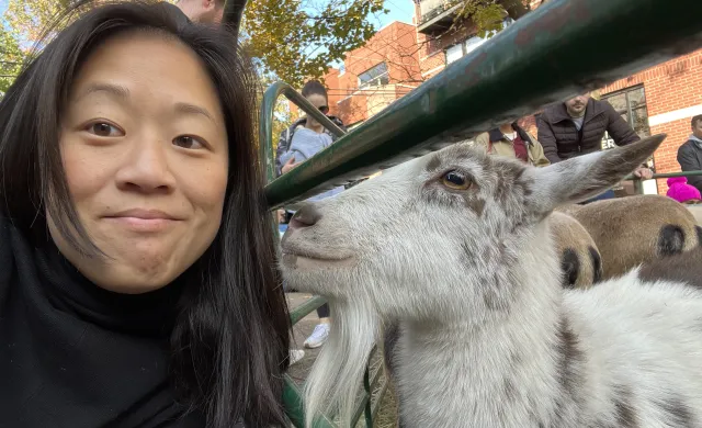 Headshot of Justine '06 with a goat