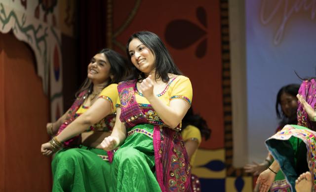 Hana Rehman, co-director of Harvard Ghungroo, the largest student-run production on campus featuring South Asian culture, dancing in her costume for the traditional Garba Raas dance. 