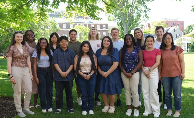 Student Interns posed on the grass of Radcliffe Institute.