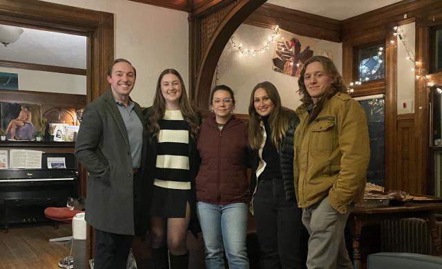 Quinn posing for a group photo with his friends during Thanksgiving