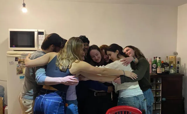 Rafid in the middle of a giant group hug with his friends from study abroad in Ushuaia, Argentina.
