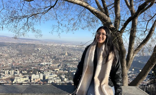 Lizbeth pictured with a view from the top of Tbilisi behind her. 