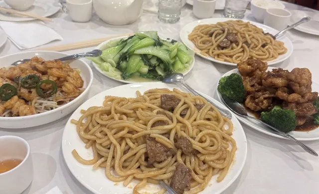 A picture of food, including noodles and chicken, ordered at Jade Garden.