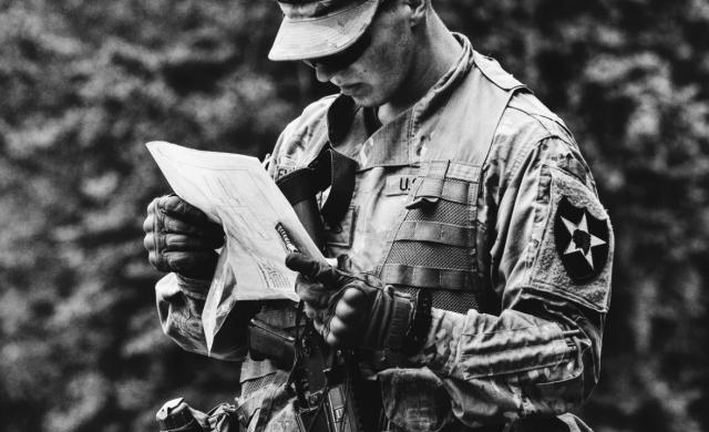 Soldier analyzes paper