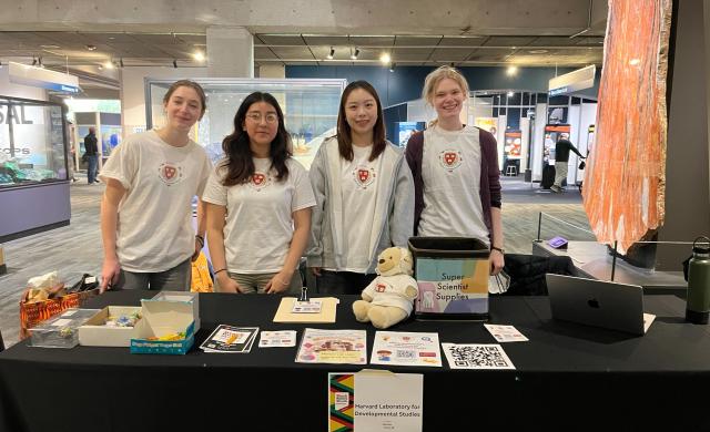 4 researchers at Harvard LDS at a participant recruitment event at the Museum of Science!