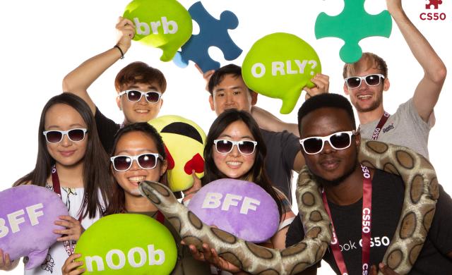 Photo booth photo of Inno and other staff cohort members at the fall 2022 Puzzle Day.