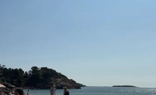 Beach with girl in corner of photo