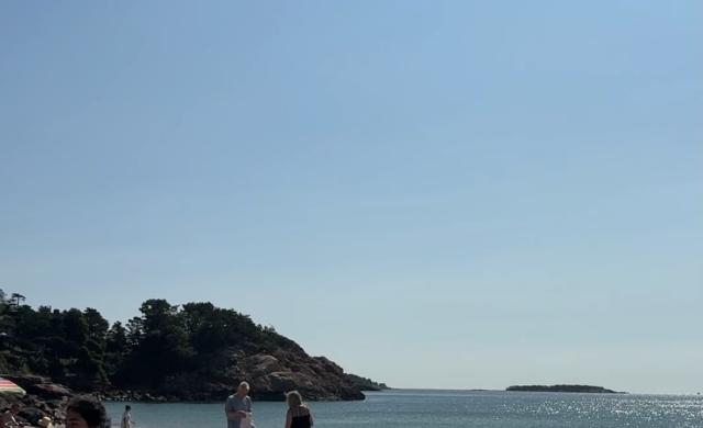 Beach with girl in corner of photo
