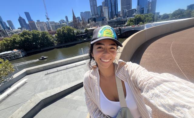 A smiling selfie on a sunny day with the Melbourne city skyline in the back