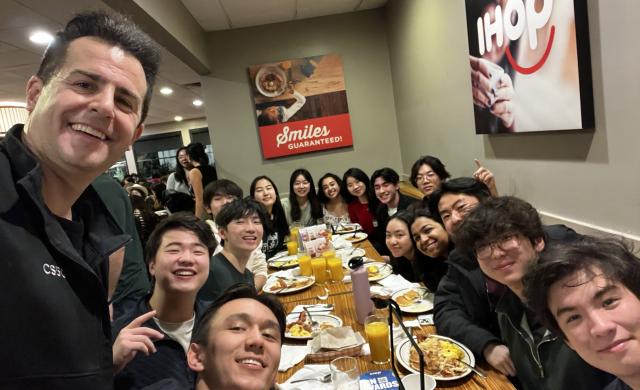 Group photo of CS50 Hackathon group at IHOP Breakfast