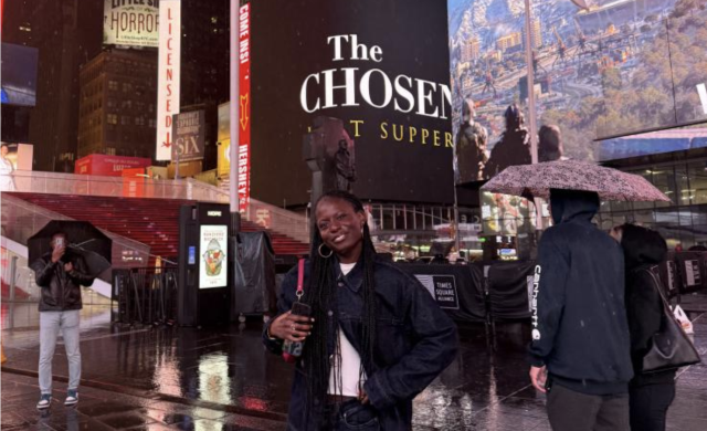 I smile for a photo at Times Square in New York City.