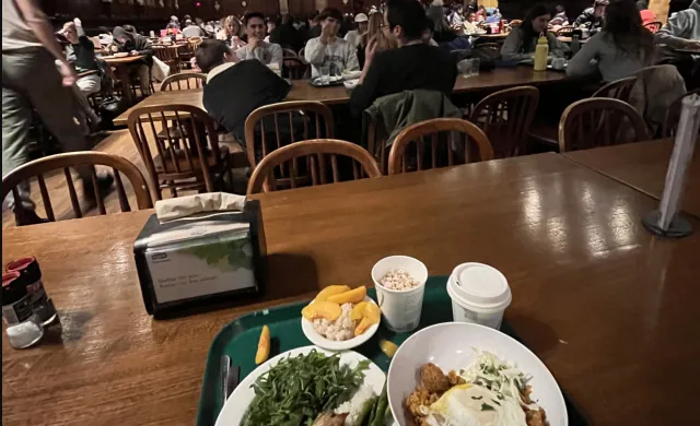 A view of Annenberg hall with a table with food in a tray.