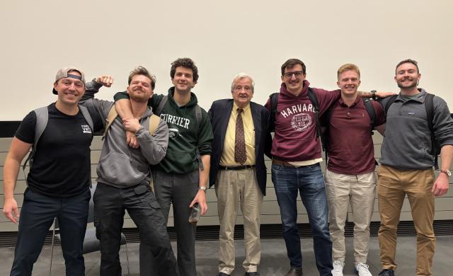 Veterans at Harvard College stand with Professor Gregory Nagy after class