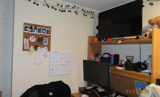 A desk set-up with a monitor and TV. 