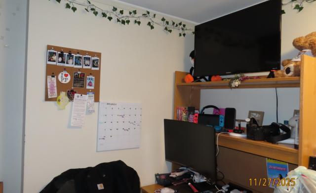 A desk set-up with a monitor and TV. 