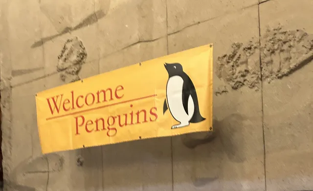 A sign saying "Welcome Penguins" as you walk up the stairs to the Quincy House Dining Hall