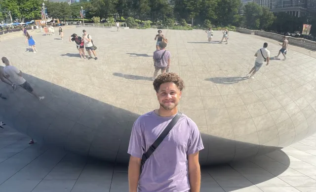 Eli Standing in Front of The Bean in Chicago