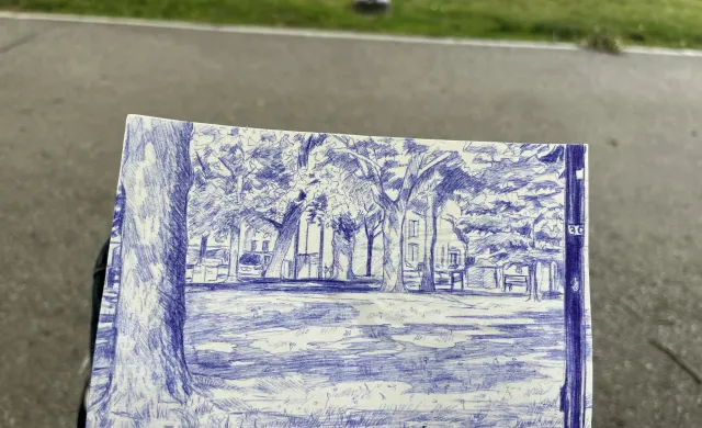 Sketch of a park environment in blue ink on a notepad. 