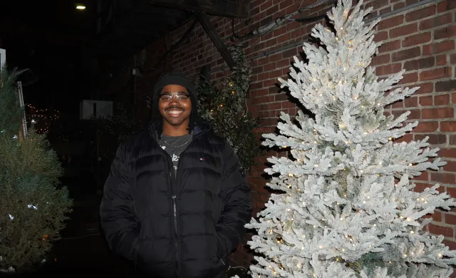 Me standing next to a white tree