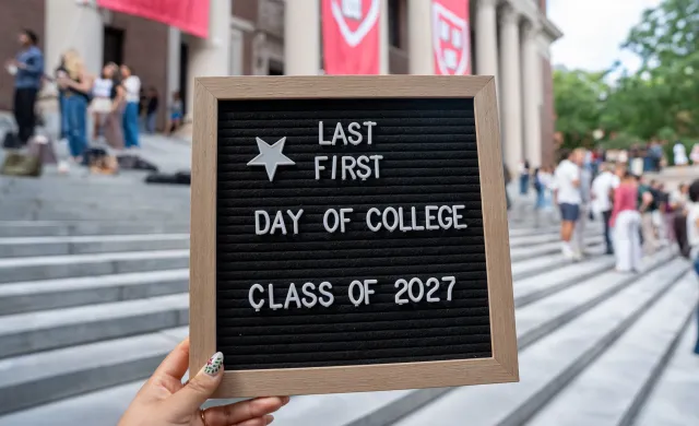 A letter board stating "Last First Day of College Class of 2027." 