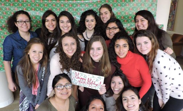 The Latinas Unidas board members posing for a picture at the Holiday party. 