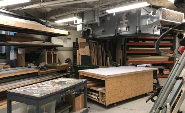 The scene shop, with tables and saws and wood set up for set building