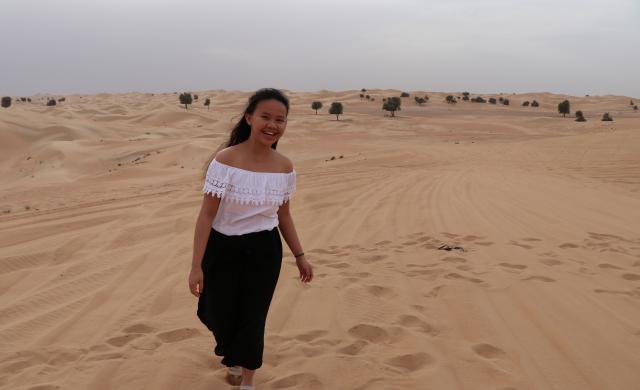Student walking in dessert