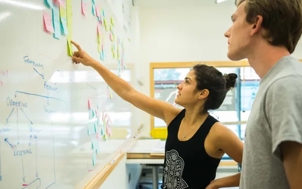 two students in a classroom