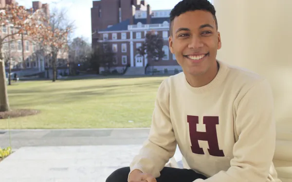 Student sitting in Radcliffe Yard