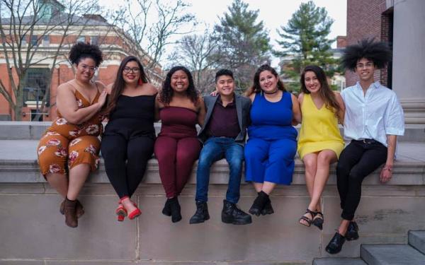 Maribel and friends sit on Widener Library's edge. 
