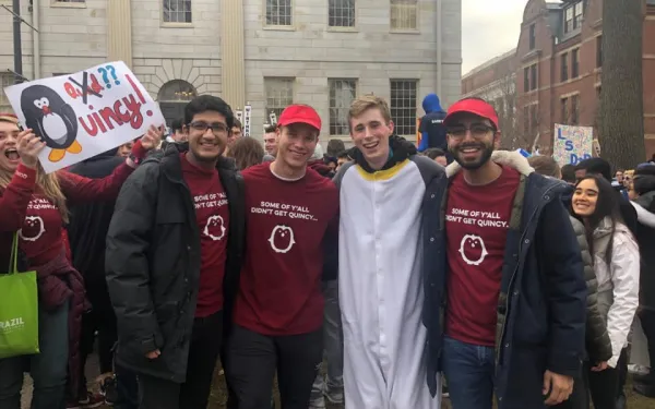 A group of students wearing Quincy House attire