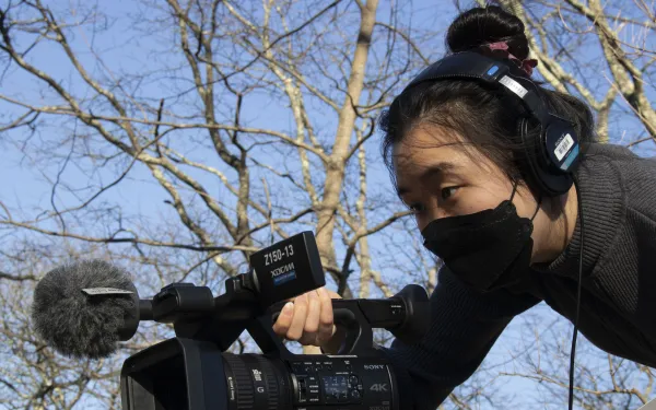 Image of author holding a camera