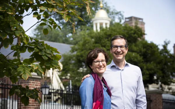 Nina Zipser and David Laibson stand in front of Lowell House