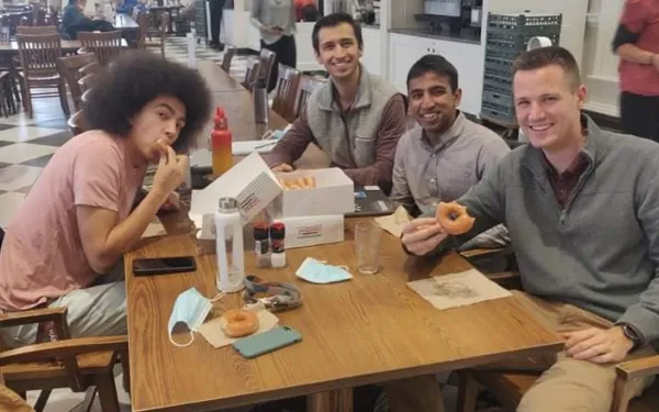 Picture of myself and three friends in Leverett Dining Hall