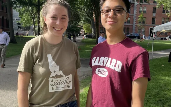 Two students standing in Harvard Yard