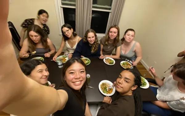 Erika and friends gathered around a table having a meal