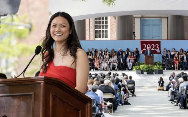 Woman at podium with stage background