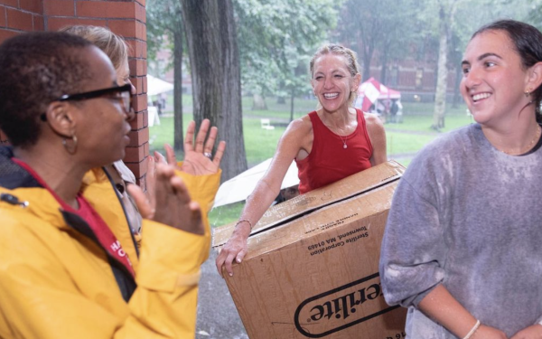 Students move in through the rain