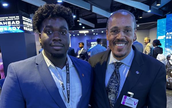 Denzel Ekes and Astronaut Benjamin Alvin Drew pictured together smiling at the camera.