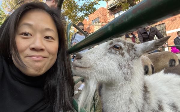 Headshot of Justine '06 with a goat