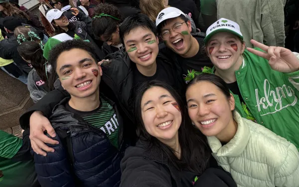 A group picture of the author and his blocking group smiling at the camera in Currier-themed merchandise.