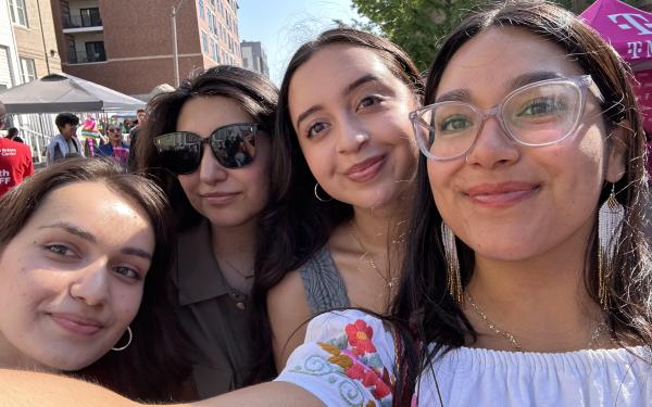 Group photo of Lizbeth and friends at a carnival.